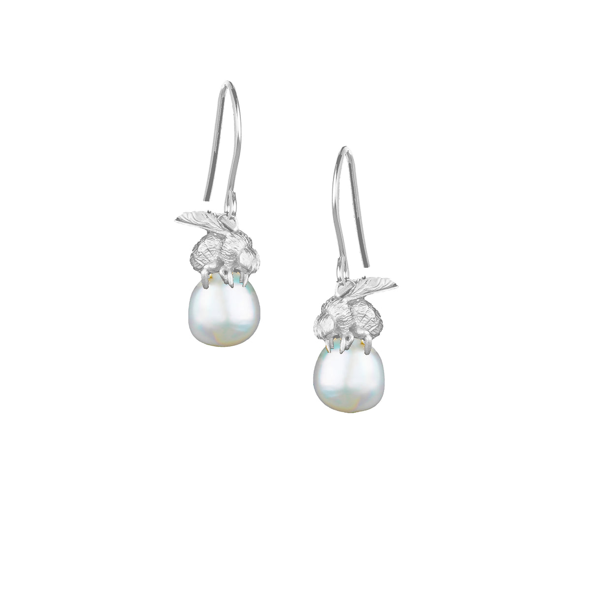 Silver honeybee resting on a pearl charm on earrings