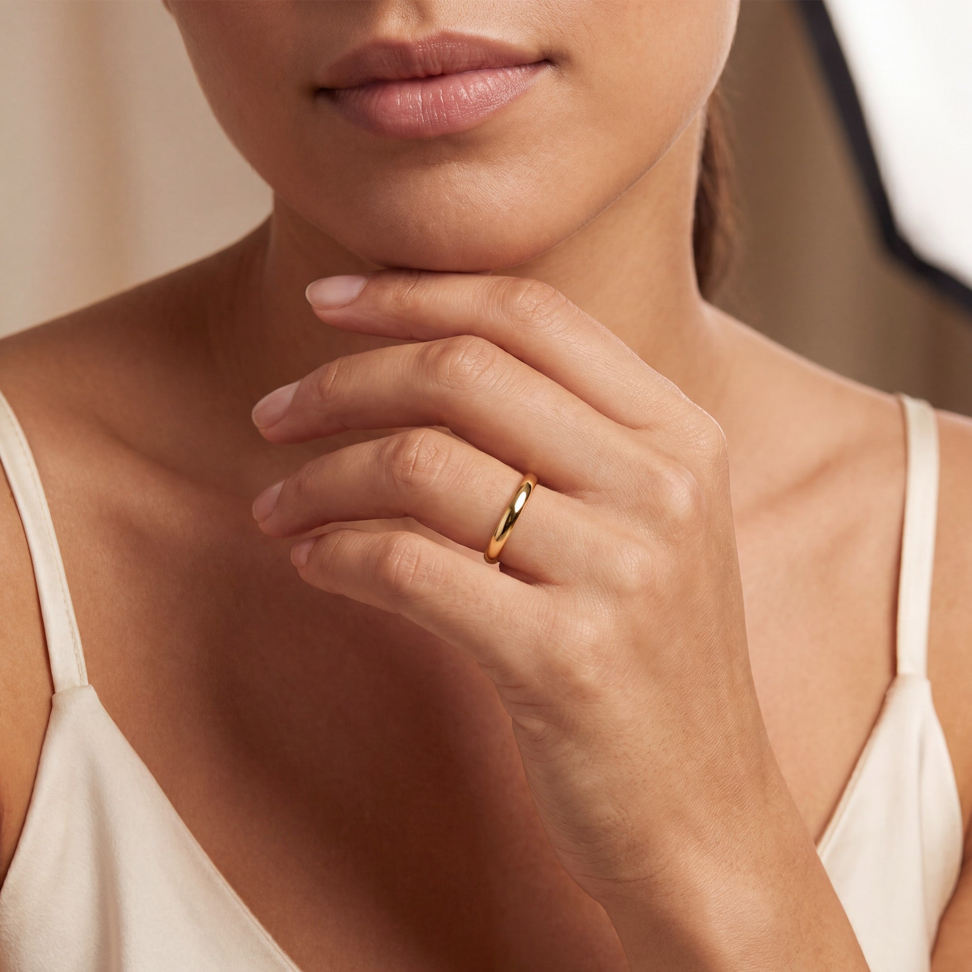 18ct gold court wedding ring on a woman's hand