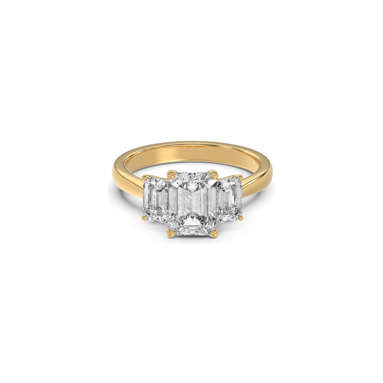 A yellow gold ring featuring a three-stone emerald-cut diamond setting, shown on a plain white background.