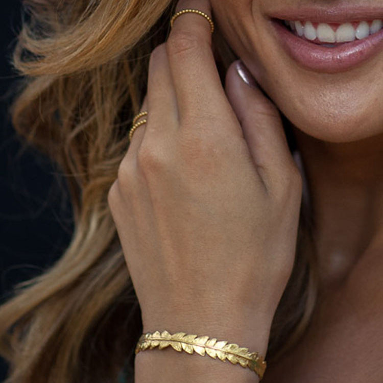 Silver Fern Leaf Cuff Bracelet - Small worn by a Rocky Barnes, showcasing intricate design and elegance.