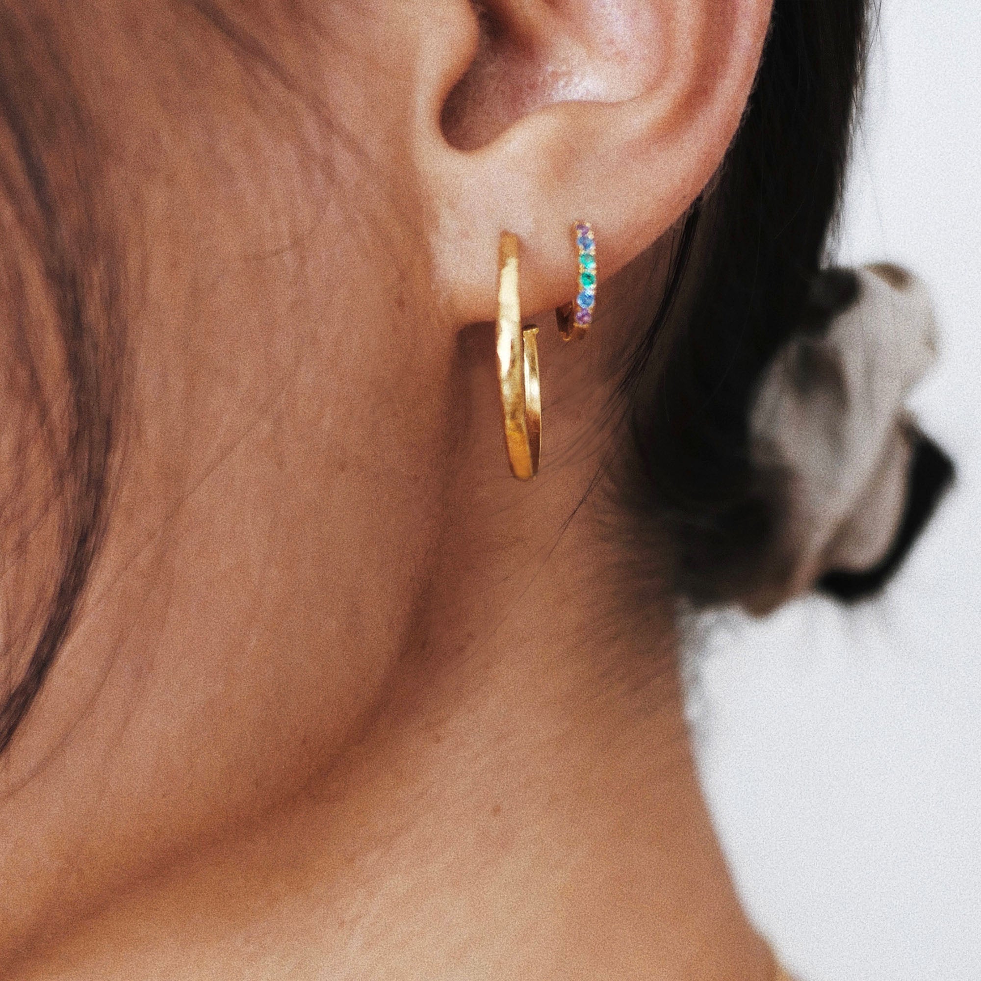 18ct gold plated silver hammered hoop earrings worn on ear