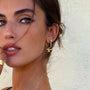 Gold Swallow Stud Earrings worn by a model, showcasing their elegant design and beautiful craftsmanship.