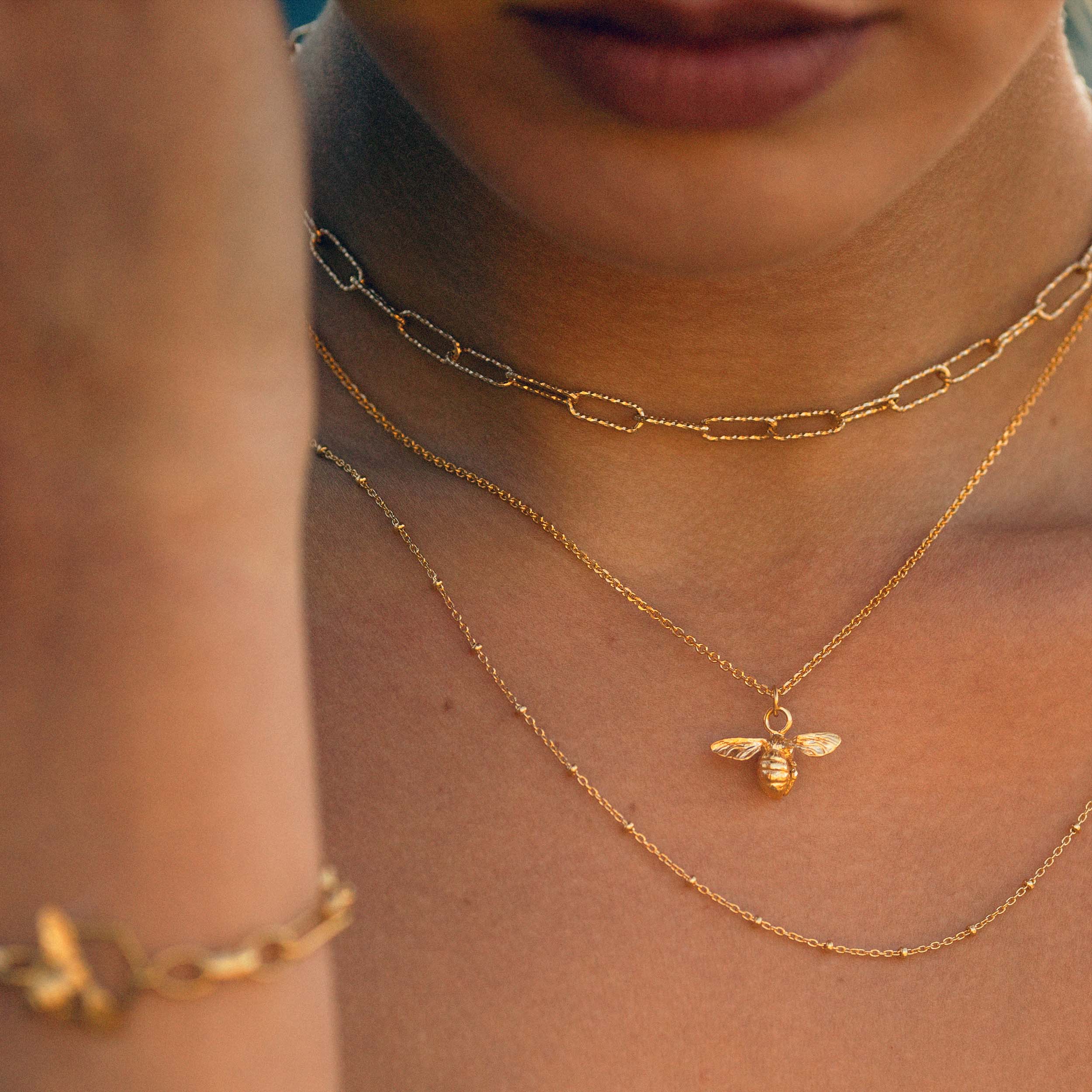 18ct gold plated silver bee charm pendant on chain necklace worn on woman