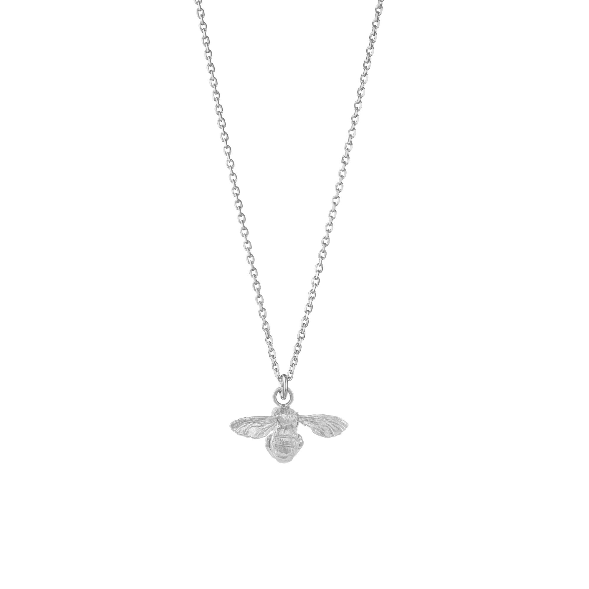 Close up of silver bee pendant on chain necklace
