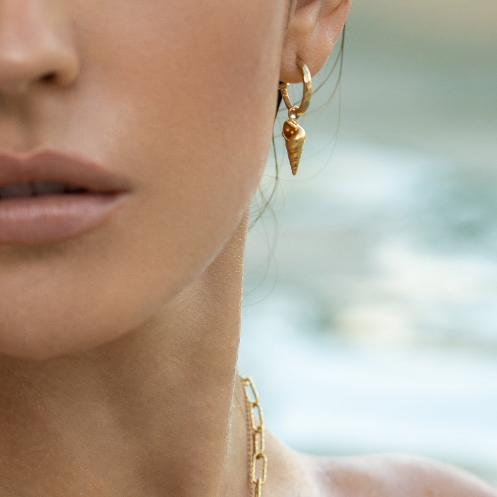 Gold mini hammered hoop and spiral shell  earrings by Zoraida London Jewellery