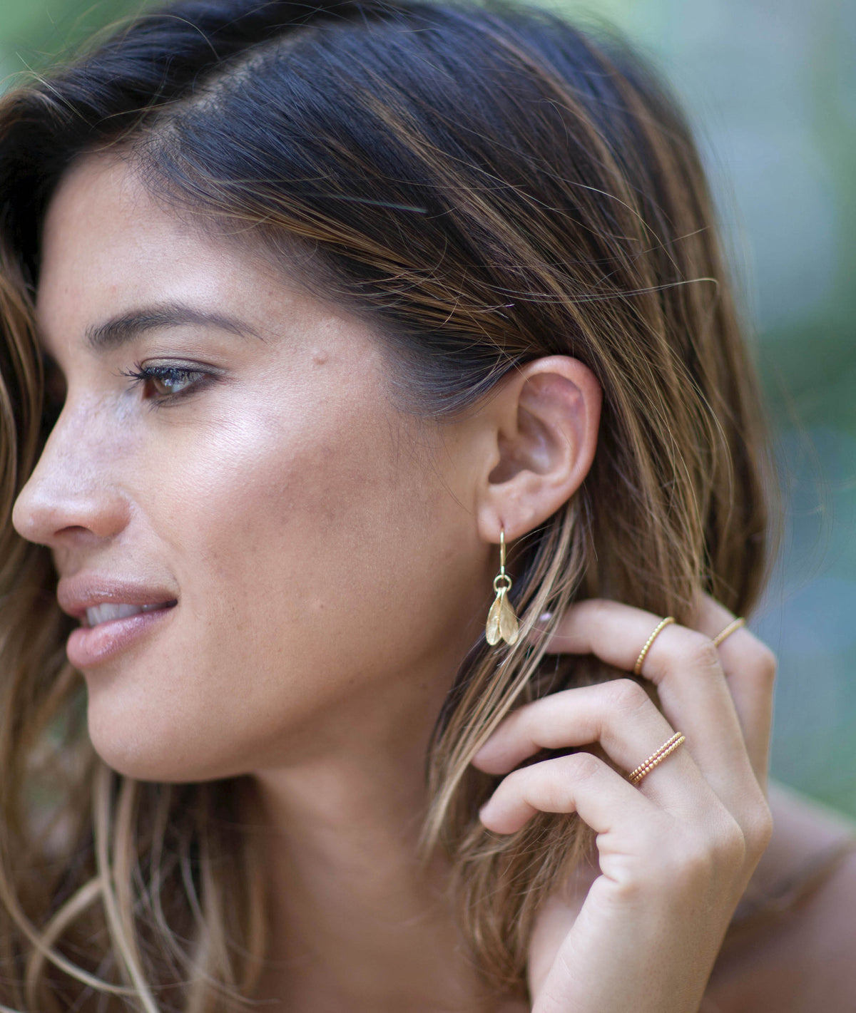 Model wearing Silver Mini Double Leaf Earrings, showcasing their delicate design and stylish appeal.